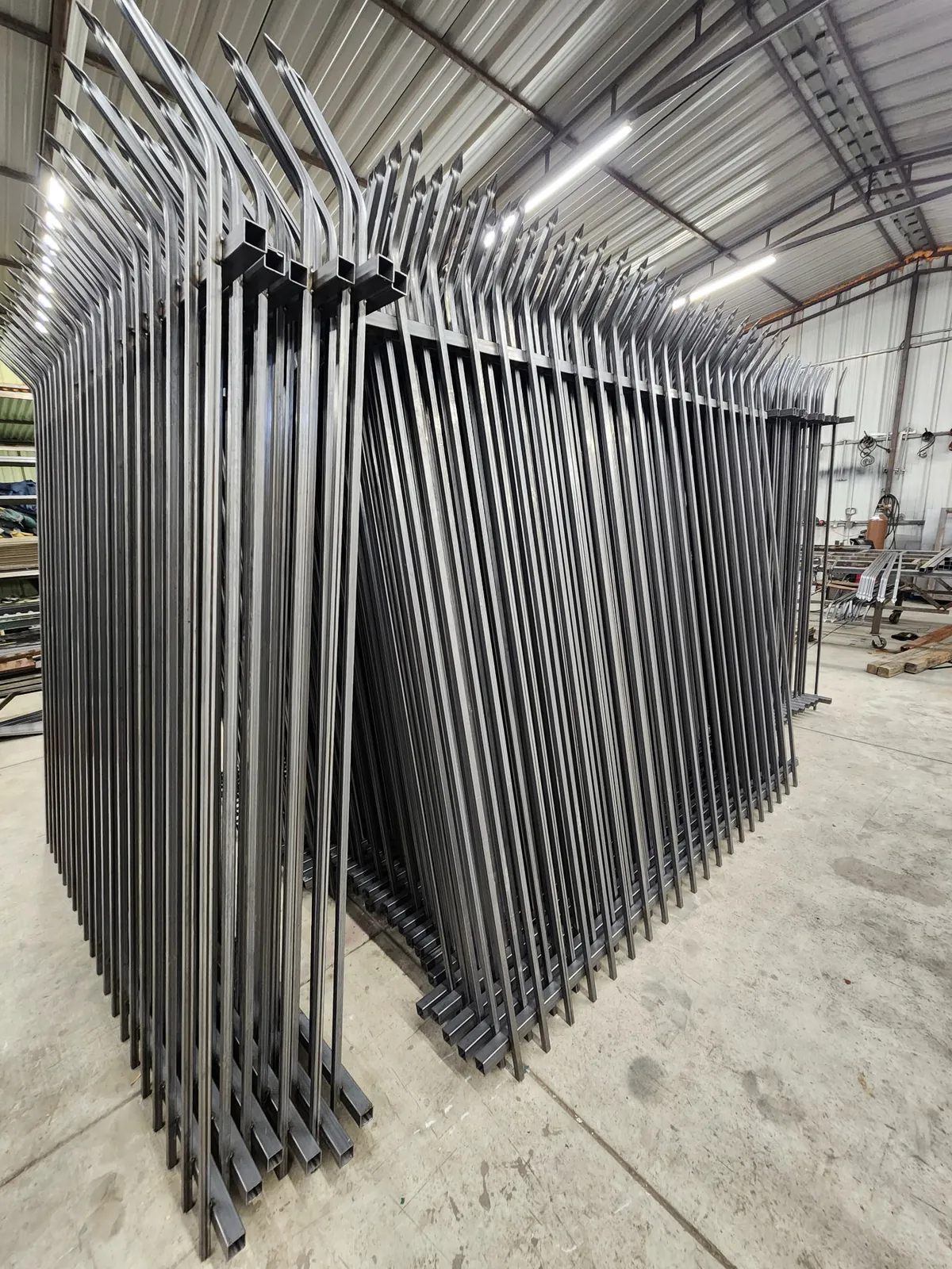 Commercial spear-top fence panels fabricated in the shop